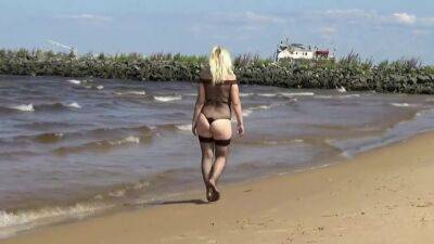 Pretty Woman In A Nylon Bodysuit On The Beach - hclips.com